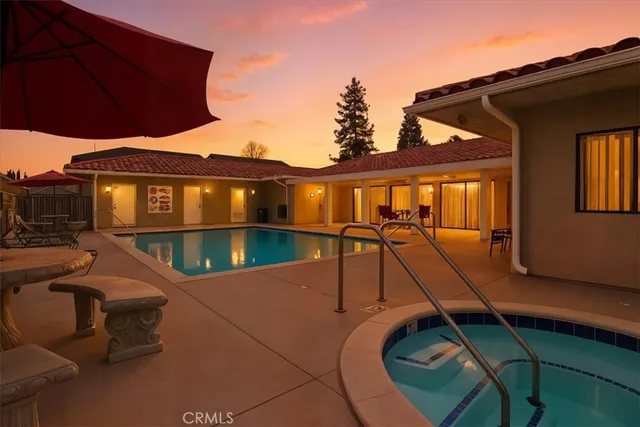 a view of a house with pool and wooden floor