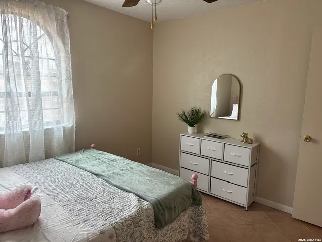 a bedroom with a bed and a dresser
