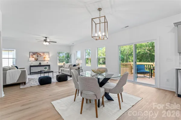 a view of a dining room with furniture window and outside view