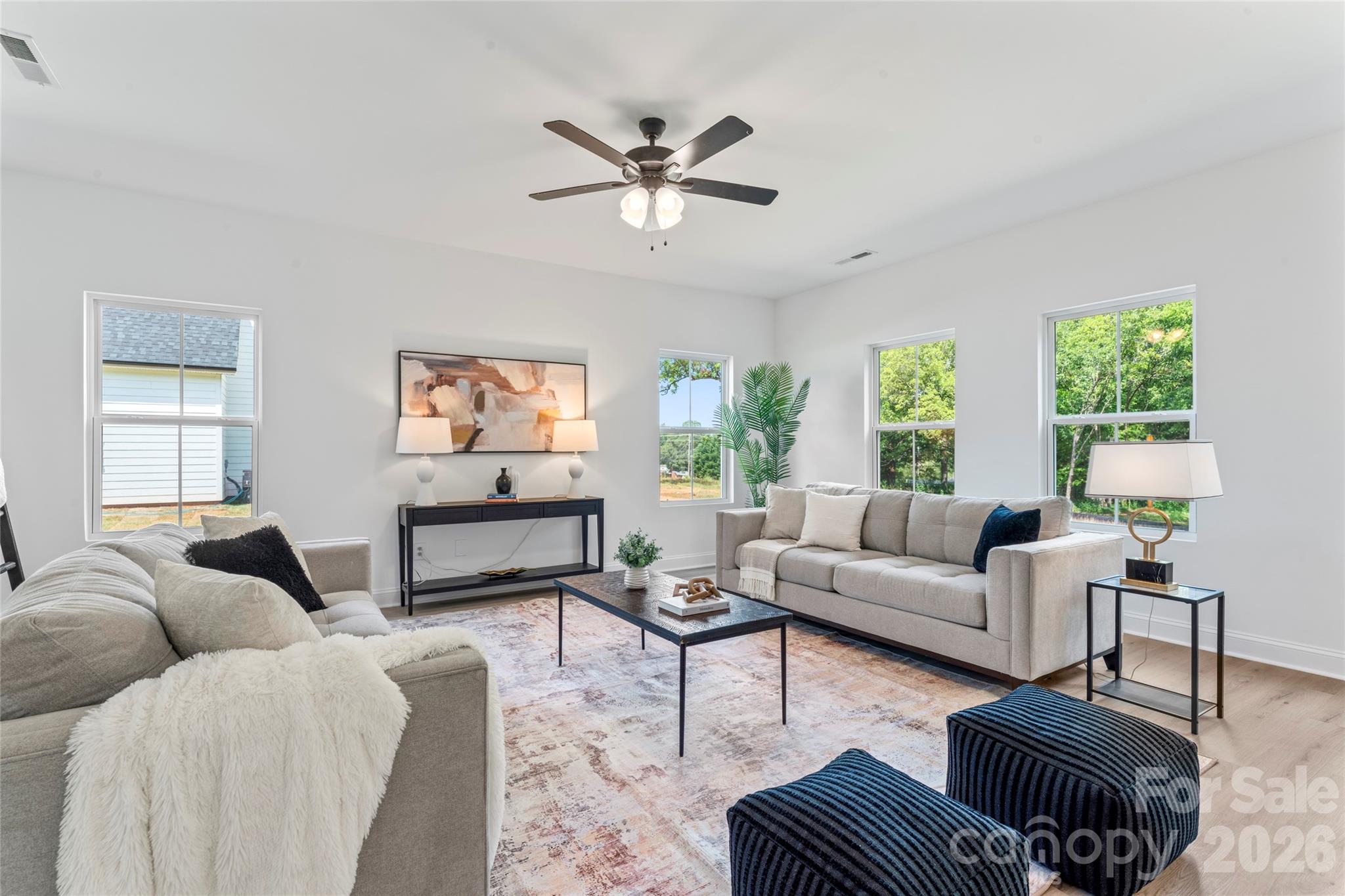 5234 Rocky River Crossing Road Harrisburg, NC 28075 - Photo 13 of 34 a living room with furniture a large window and a rug