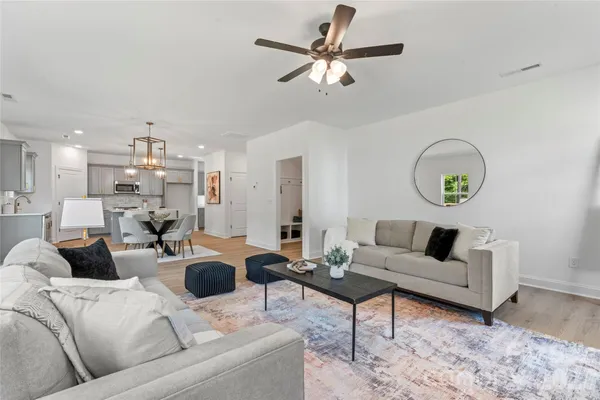 a hallway with cabinets and wooden floor