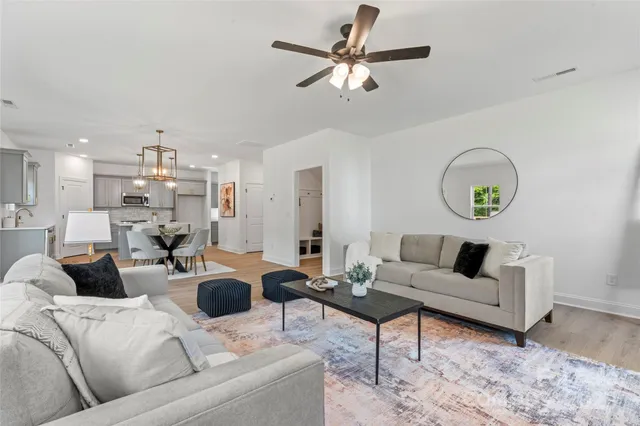 a hallway with cabinets and wooden floor