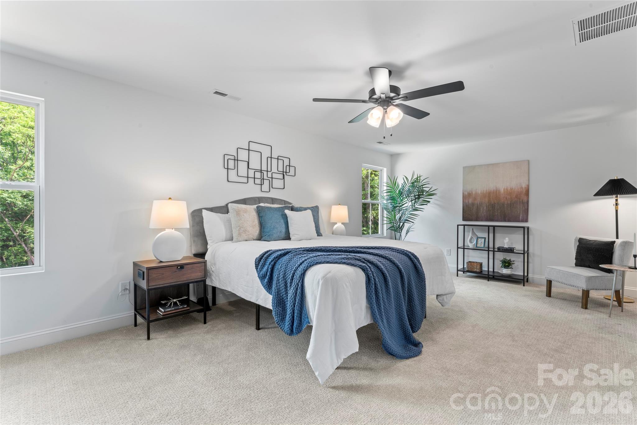 5234 Rocky River Crossing Road Harrisburg, NC 28075 - Photo 26 of 34 a bedroom with a bed and a chandelier