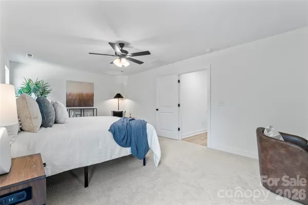 a bathroom with a sink vanity granite tub and a mirror