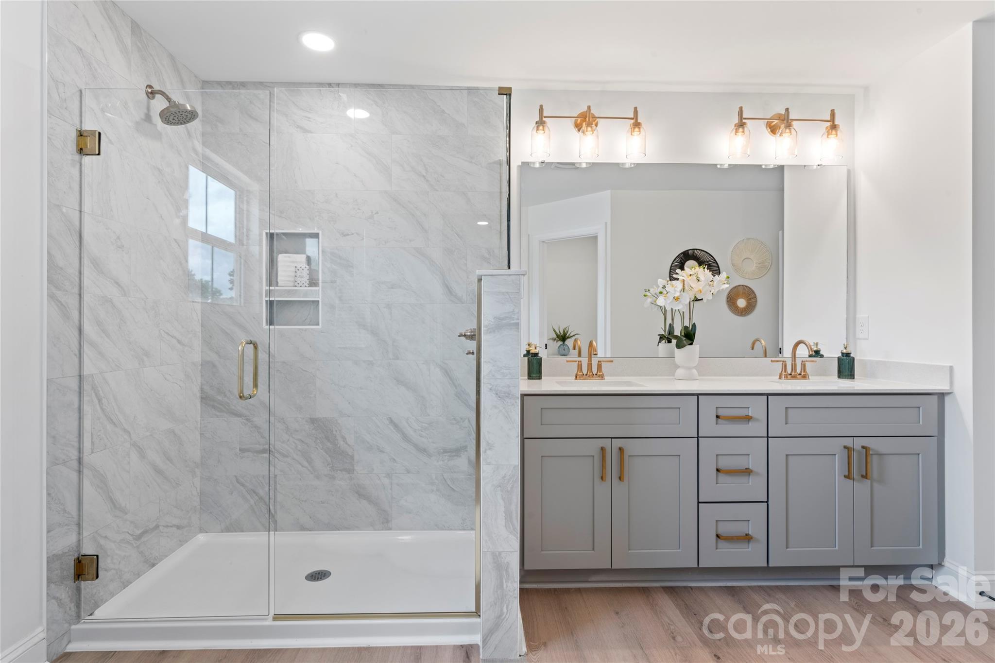 5234 Rocky River Crossing Road Harrisburg, NC 28075 - Photo 28 of 34 a bathroom with a sink and a mirror