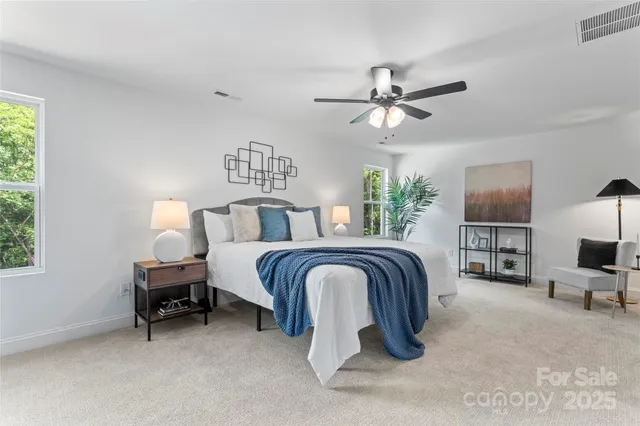 a bathroom with a sink vanity granite tub and a mirror