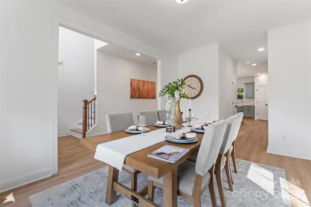a kitchen with a sink and wooden floor