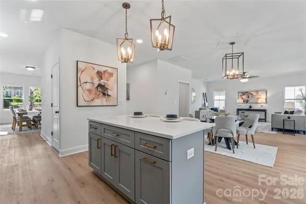a view of a kitchen wooden cabinets and wooden floor