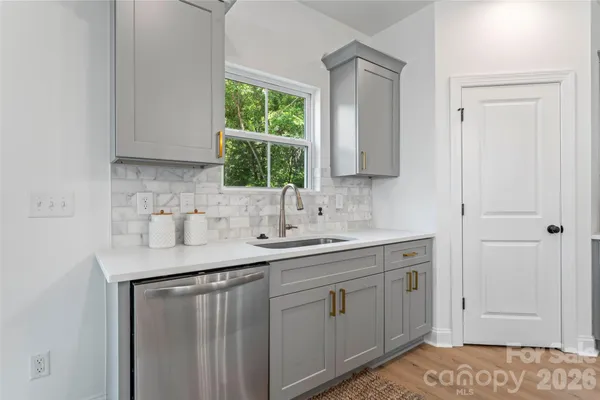 a kitchen with a sink and cabinets