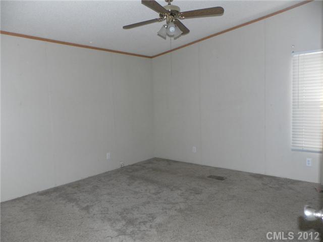2461 Campbell Lake Road Lancaster, SC 29720 - Photo 6 of 8 an empty room with a window