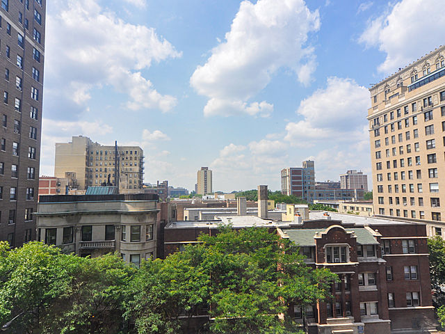 3033 North Sheridan Road, Unit 708 Chicago, IL 60657 - Photo 2 of 8 a view of a city with tall buildings