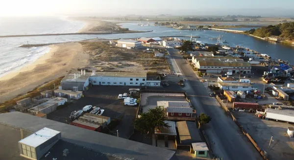 an aerial view of a city with ocean view
