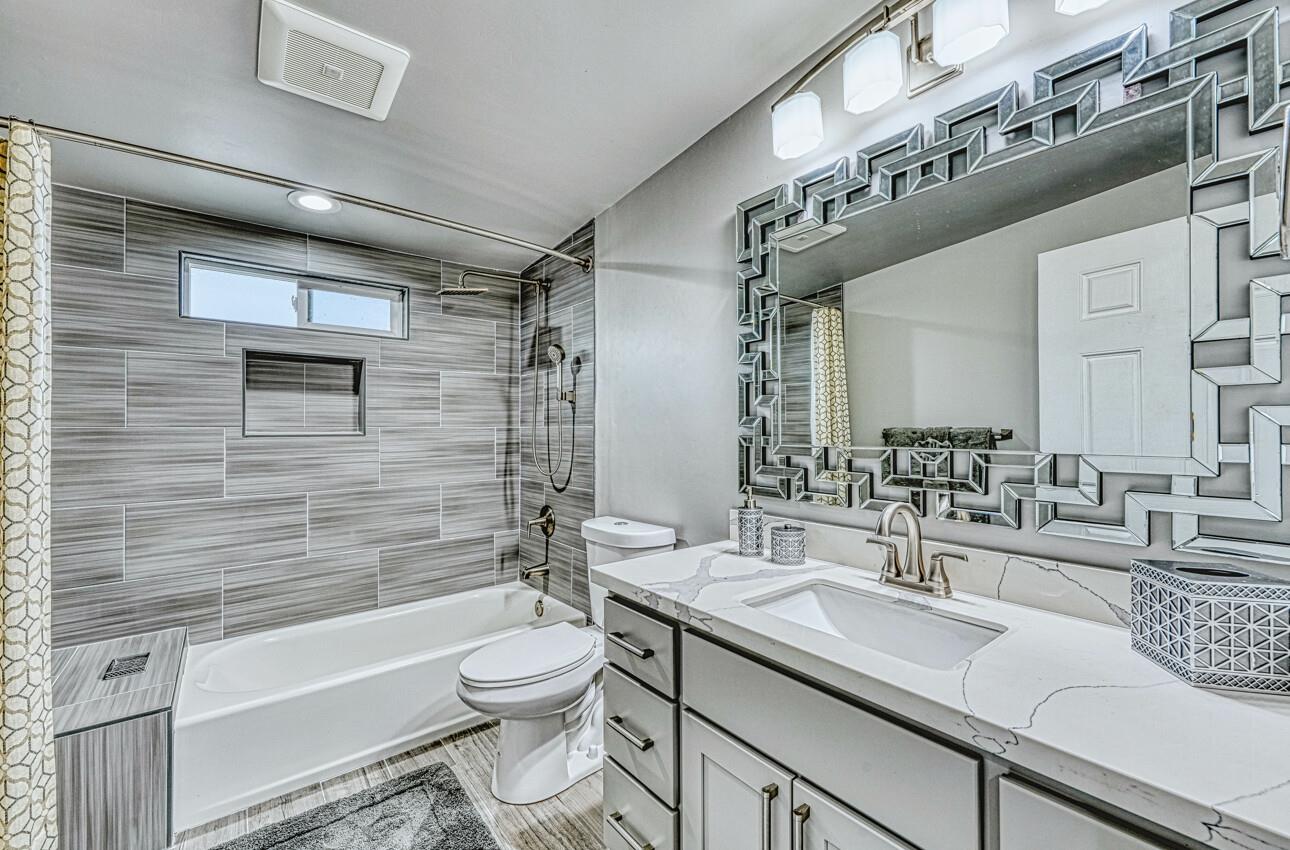 7550 Sandholdt Road Moss Landing, CA 95039 - Photo 11 of 85 a bathroom with a granite countertop toilet sink and bathtub
