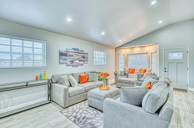 a bedroom with a bed and a couch