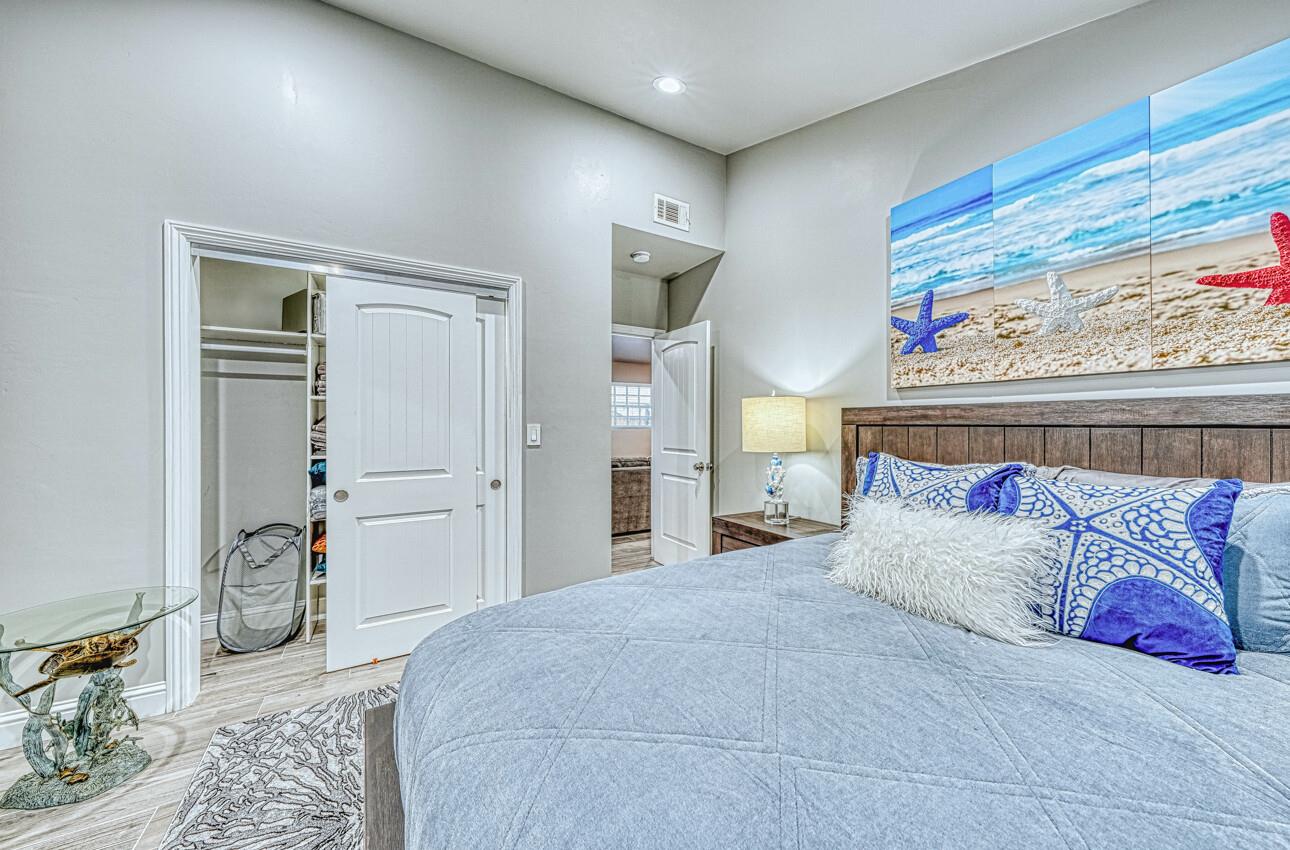 7550 Sandholdt Road Moss Landing, CA 95039 - Photo 15 of 85 a bedroom with a bed and closet