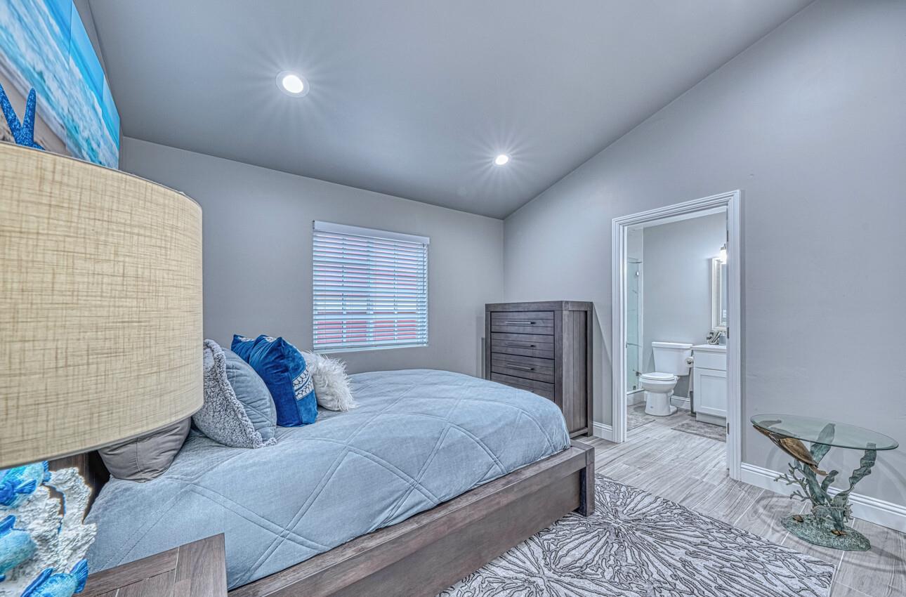 7550 Sandholdt Road Moss Landing, CA 95039 - Photo 16 of 85 a bedroom with a bed and a couch