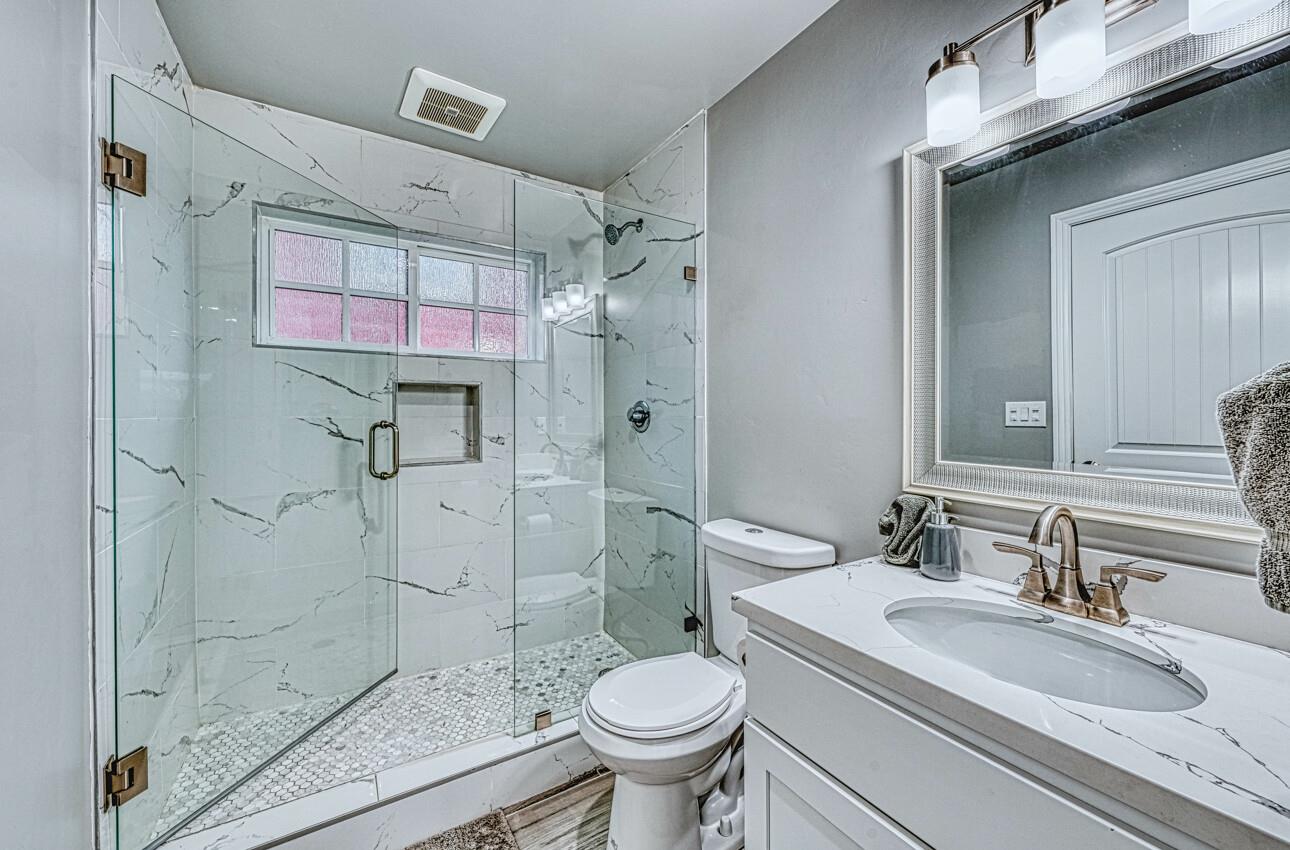 7550 Sandholdt Road Moss Landing, CA 95039 - Photo 17 of 85 a bathroom with a granite countertop toilet sink and shower