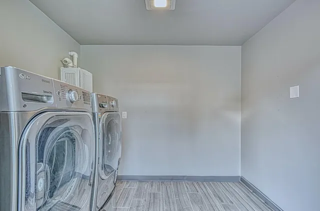 a view of backyard with small cabin and wooden fencing