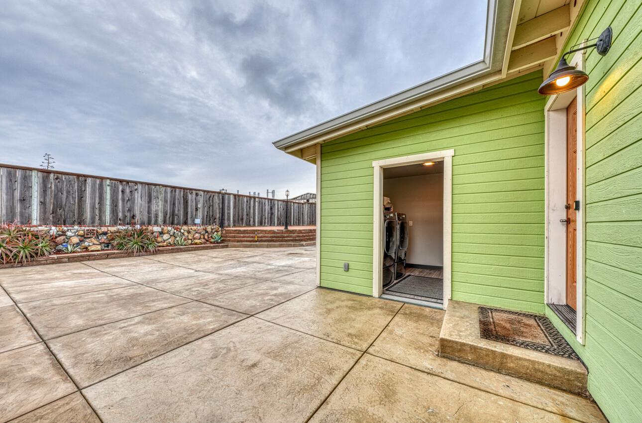 7550 Sandholdt Road Moss Landing, CA 95039 - Photo 32 of 85 a view of a house with wooden wall and floor to ceiling window