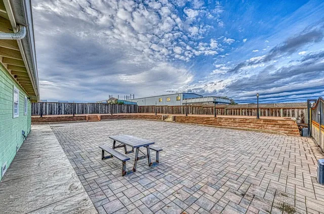 a house view with a wooden floor and seating space