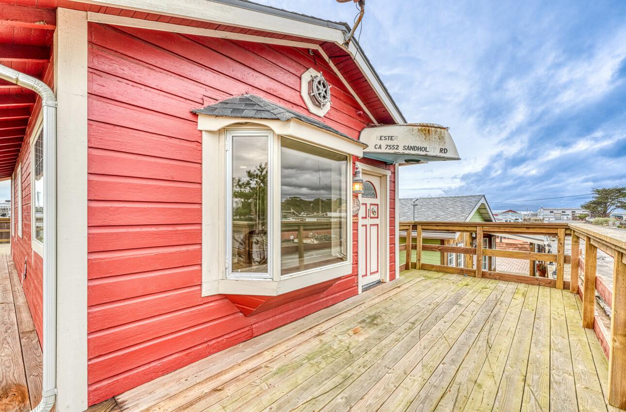 7550 Sandholdt Road Moss Landing, CA 95039 - Photo 40 of 85 a view of a balcony with wooden floor and fence