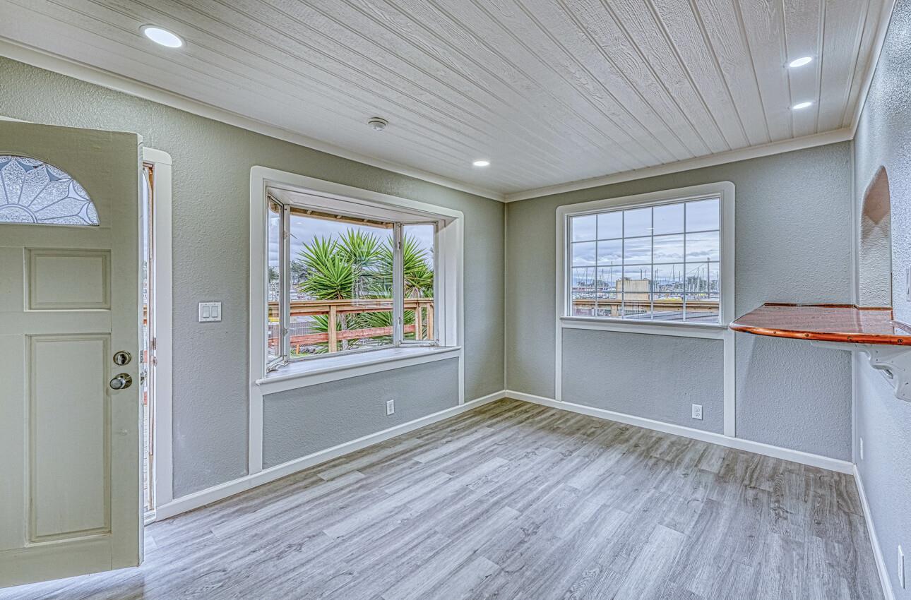 7550 Sandholdt Road Moss Landing, CA 95039 - Photo 42 of 85 wooden floor in an empty room with a window