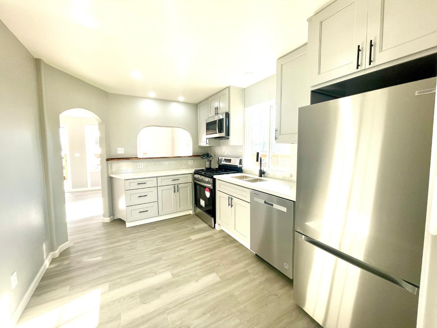 7550 Sandholdt Road Moss Landing, CA 95039 - Photo 46 of 85 a kitchen with stainless steel appliances a refrigerator sink and cabinets