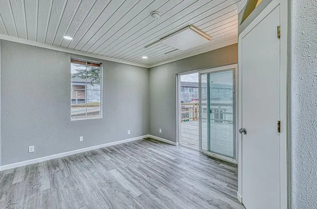 a bathroom with a window and a shower