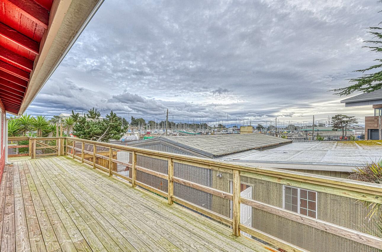 7550 Sandholdt Road Moss Landing, CA 95039 - Photo 50 of 85 a view of a balcony with wooden floor and city view