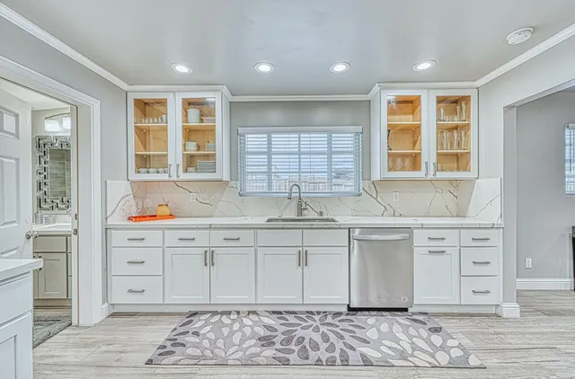 a kitchen with a table chairs and a stove
