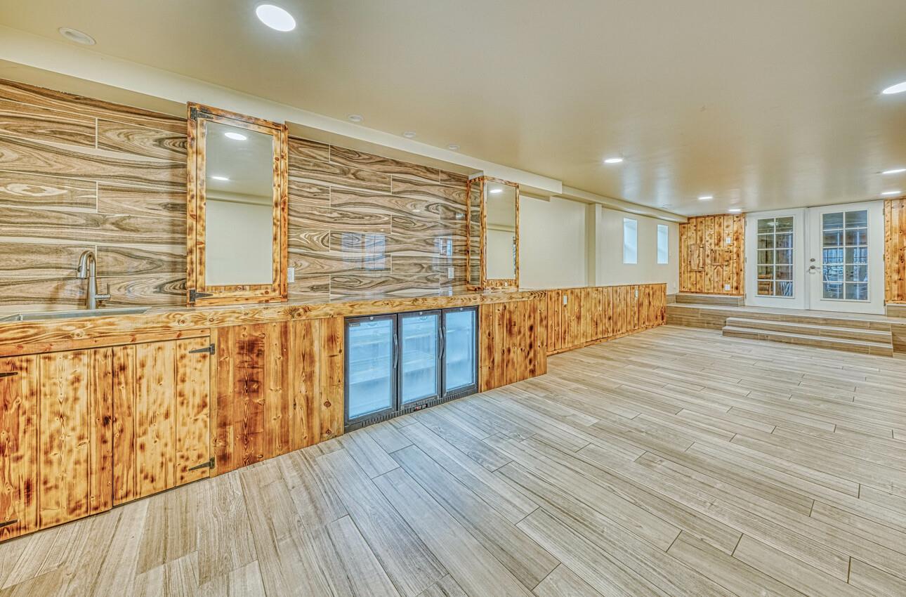 7550 Sandholdt Road Moss Landing, CA 95039 - Photo 56 of 85 wooden floor in an empty room with a window