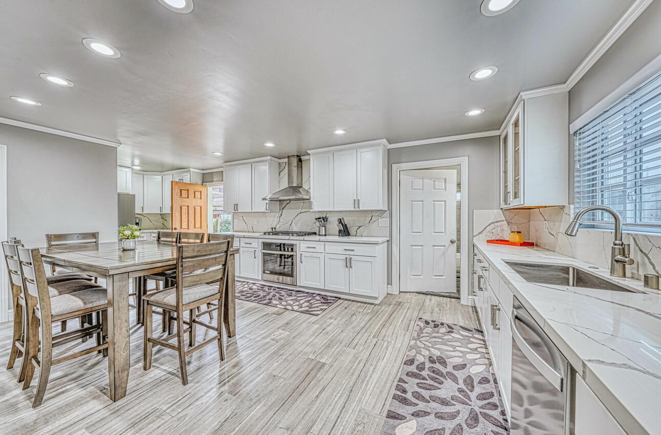 7550 Sandholdt Road Moss Landing, CA 95039 - Photo 8 of 85 a kitchen with stainless steel appliances kitchen island granite countertop a sink and cabinets