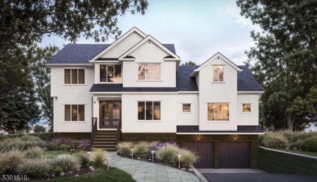 a front view of a house with yard