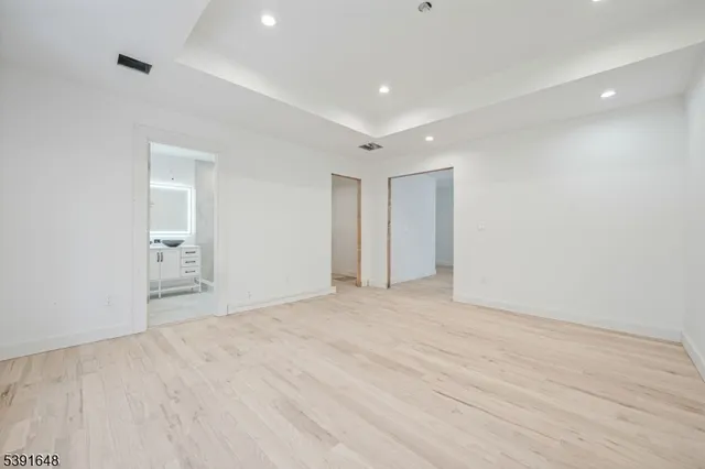 a view of a hallway with cabinet