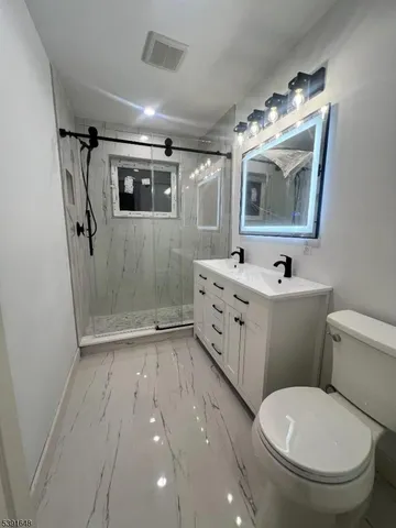 a bathroom with a tub sink and mirror