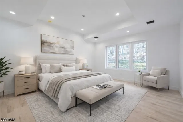 a bedroom with a bed and a couch