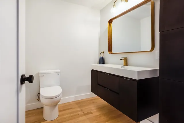 a spacious bedroom with a bed and a large window