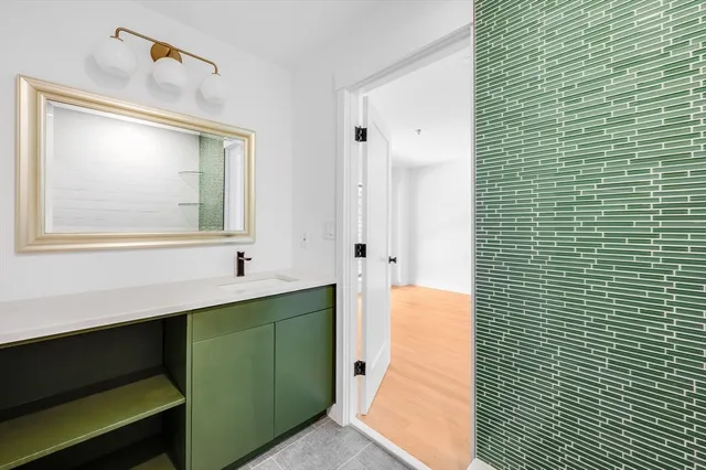 a white toilet sitting next to a bathroom sink