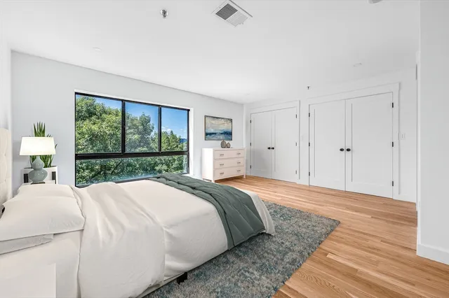 a bed room with a bed and a dresser