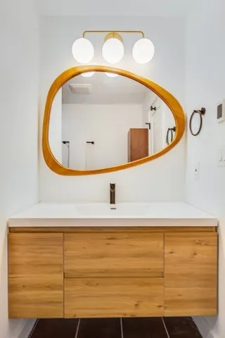 a bathroom with a sink and a mirror