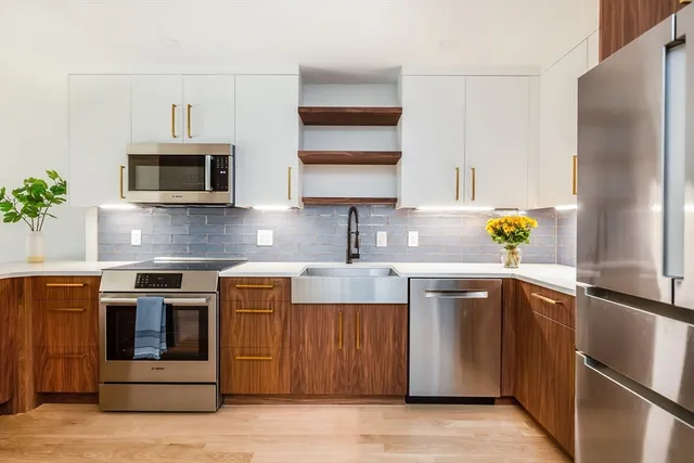 a kitchen with a sink and a refrigerator