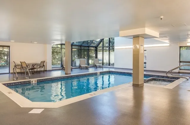 a view of terrace with couches and potted plants