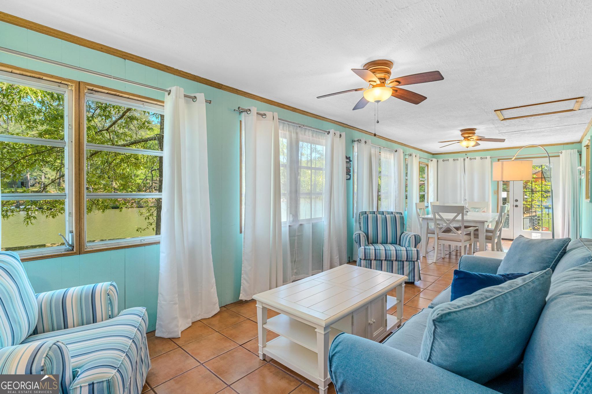 136 Yancey Road Jackson, GA 30233 - Photo 26 of 37 a living room with furniture and a large window