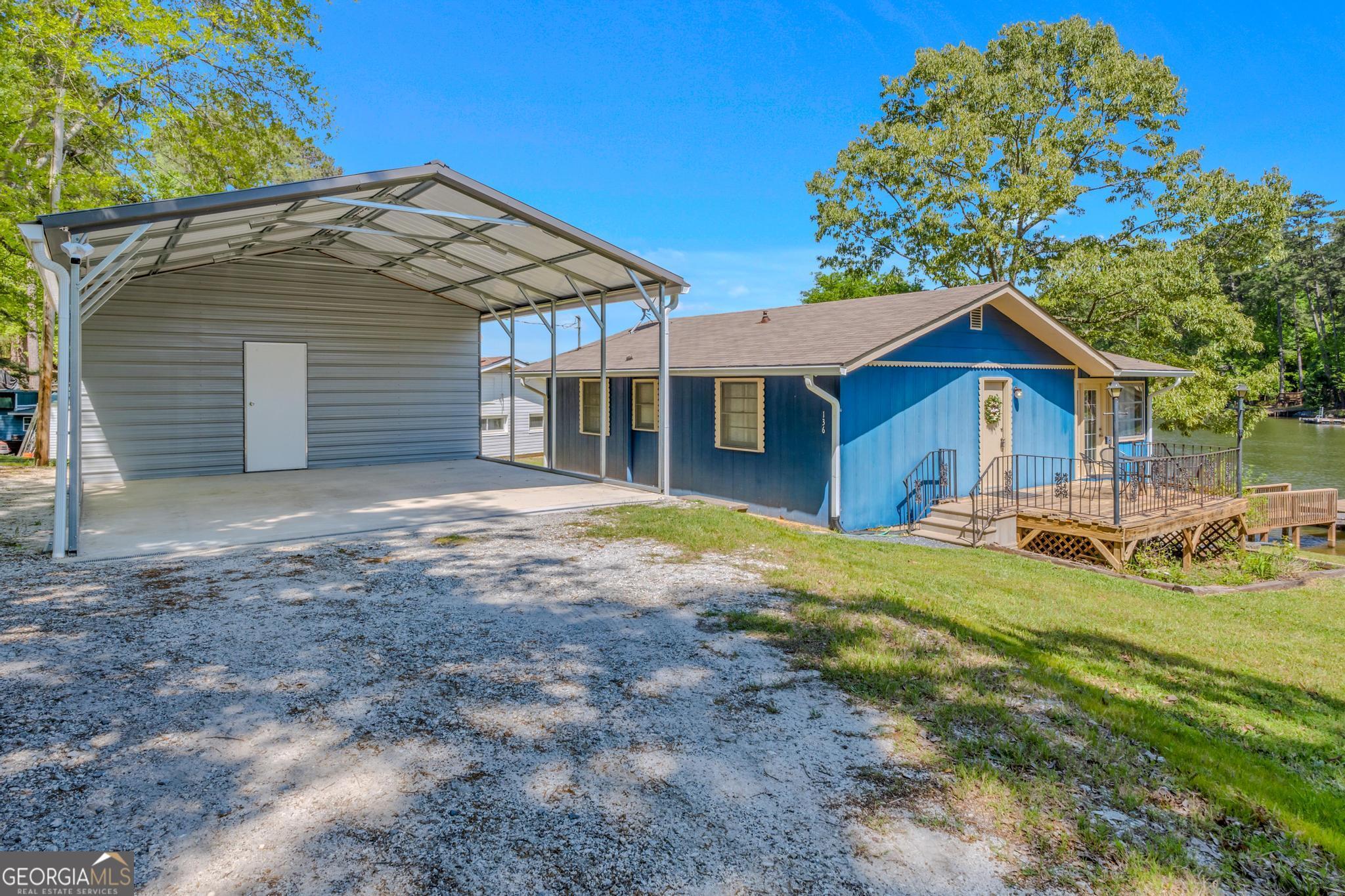 136 Yancey Road Jackson, GA 30233 - Photo 8 of 37 a front view of a house with garden
