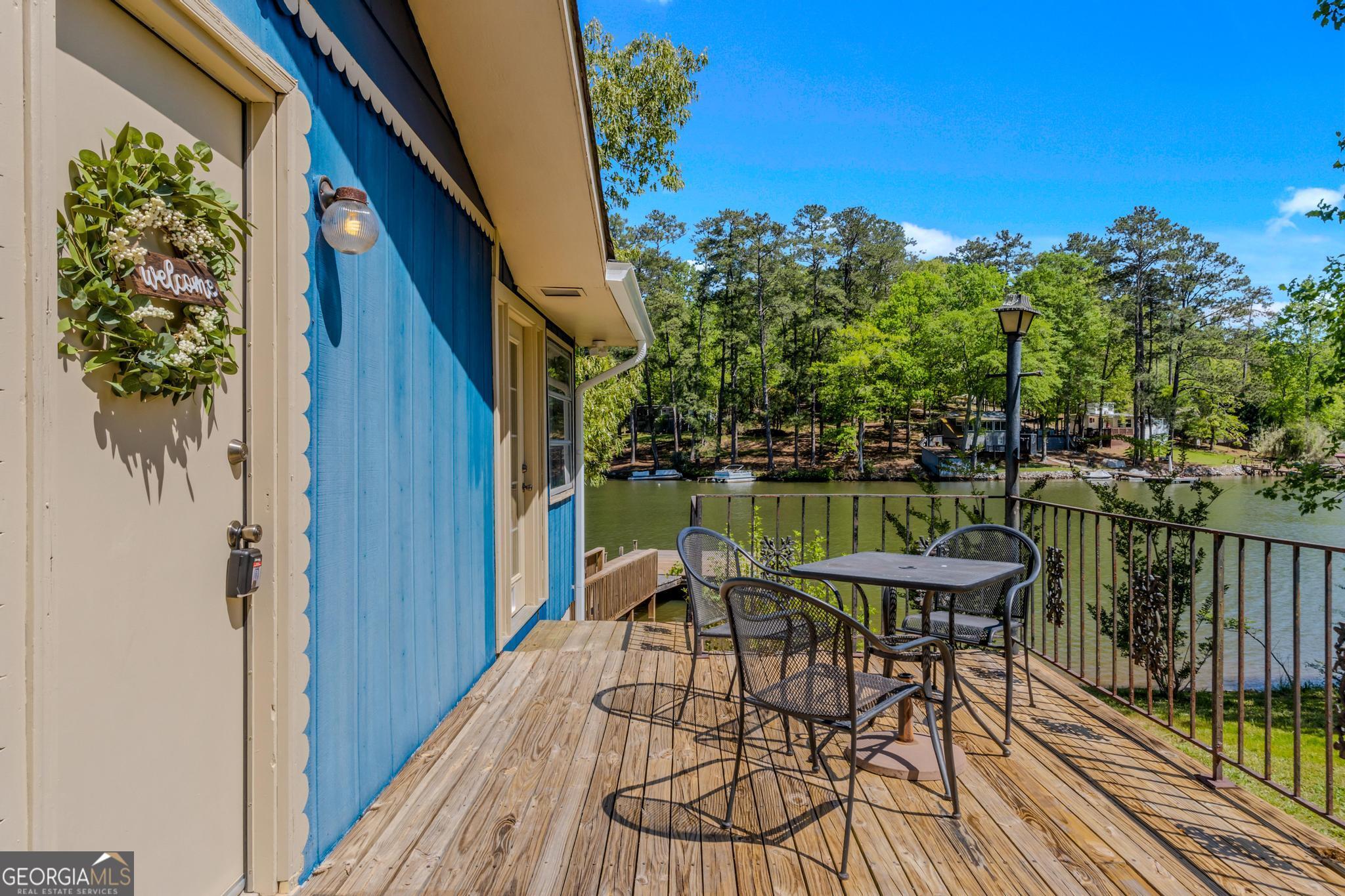 136 Yancey Road Jackson, GA 30233 - Photo 10 of 37 a view of balcony with furniture and garden