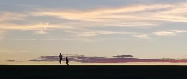 a view of ocean with sunset