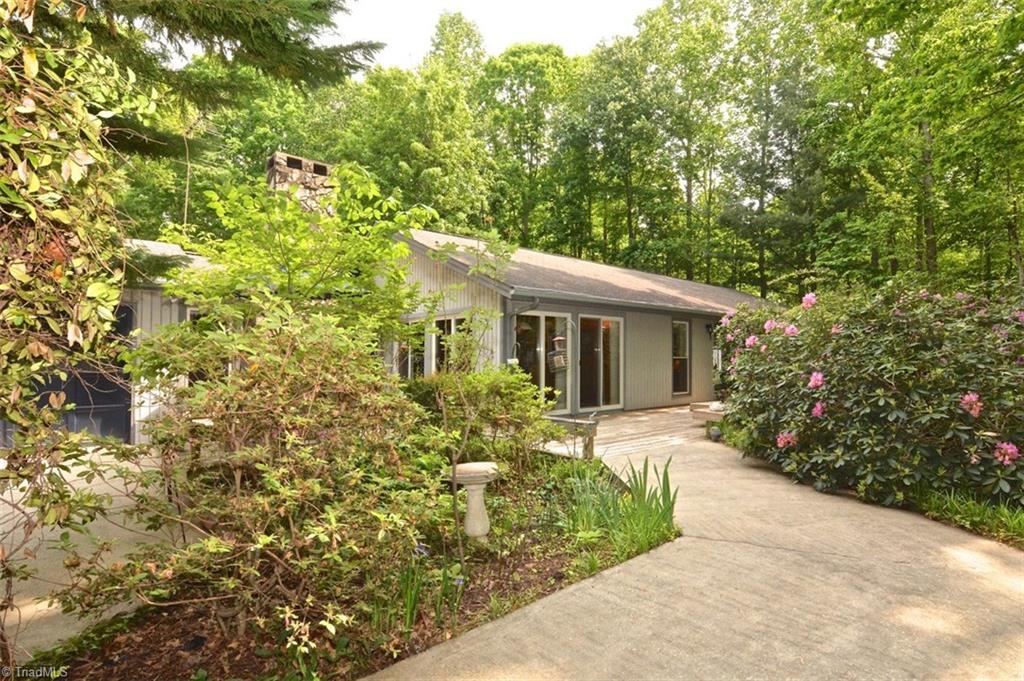 109 Mersey Road Greensboro, NC 27406 - Photo 1 of 28 Want seclusion.. a little paradise? Well you have found it here in this quiet neighborhood on dead end street plus a low maintenance vinyl wrapped home on 1.39 acres.