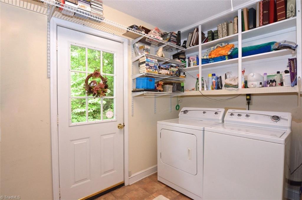 109 Mersey Road Greensboro, NC 27406 - Photo 14 of 28 This wonderfully large laundry room can be used for multiple purposes....it enters on to the deck. The same vinyl tile flooring is used here as is used in the kitchen, baths & sunroom. This room has numerous shelving. The home is also wired for a generator.