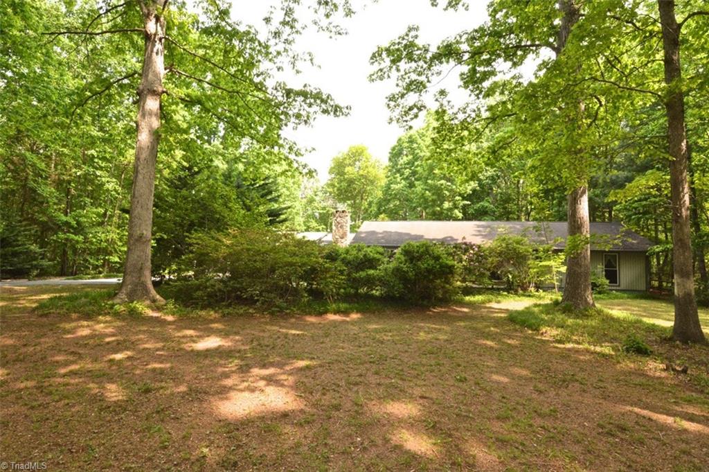 109 Mersey Road Greensboro, NC 27406 - Photo 27 of 28 The deep front yard is mostly mulch for low maintenance.