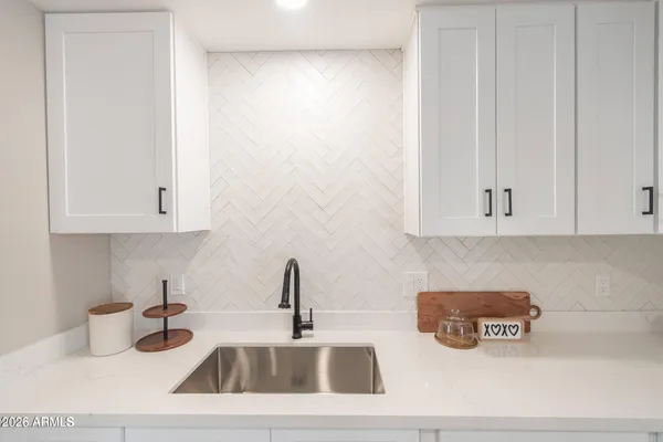 a kitchen with a sink and cabinets